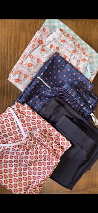 a set of men's boxer shorts on a wooden table