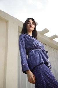 a woman in a blue polka dot pajama